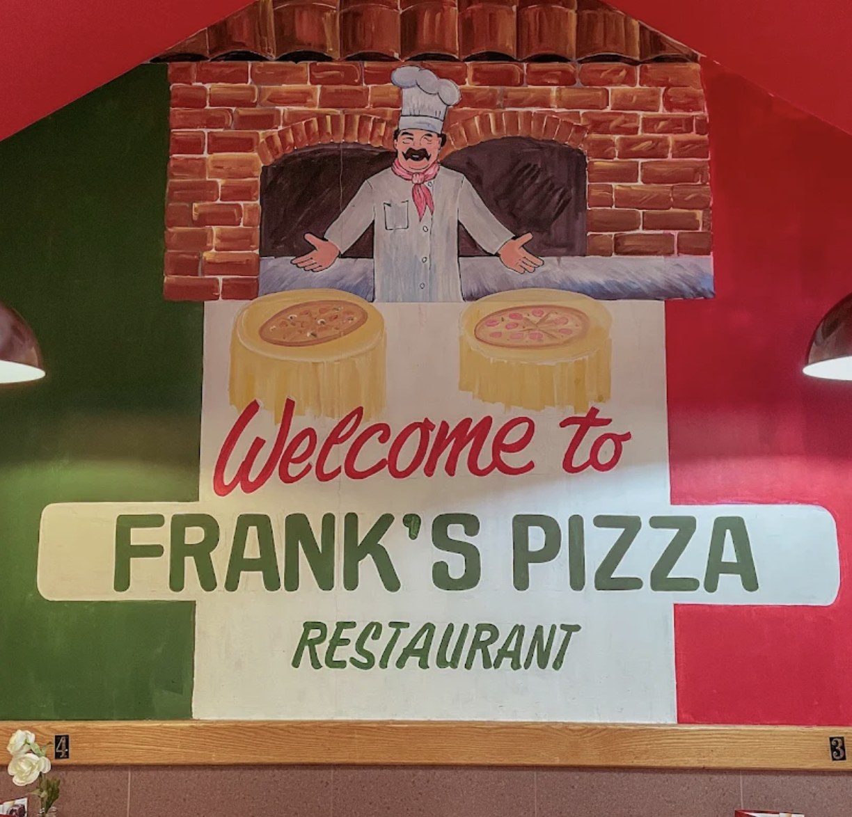 Welcome to Frank's Pizza mural inside the restaurant