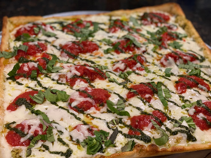 Sicilian pizza with fresh mozzarella, tomato sauce, pesto, and basil at Frank's Pizza, Oak Ridge New Jersey